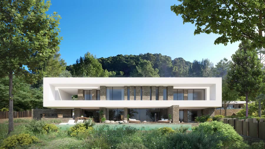 Modern white villa with stone accents set against dense forest, seen from the pool